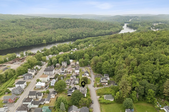 9 Maple St, Jay, ME 04239 - aerial view of property and surrounding area featuring a heavily wooded area and nearby suburban area