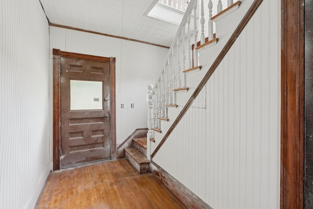 9 Maple St, Jay, ME 04239 - entryway with wood finished floors, stairs, and ornamental molding
