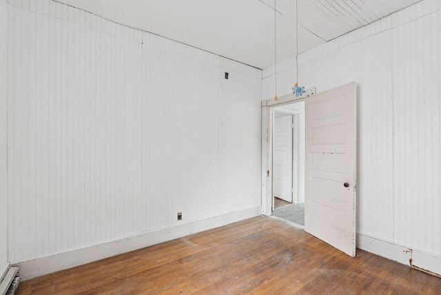 9 Maple St, Jay, ME 04239 - unfurnished room featuring wood finished floors and baseboard heating