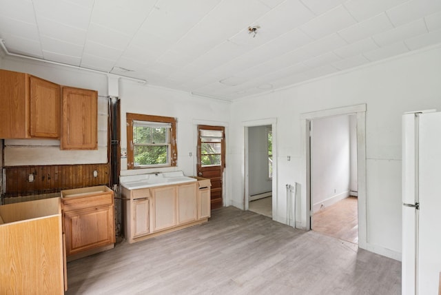 9 Maple St, Jay, ME 04239 - kitchen featuring freestanding refrigerator, light wood-style floors, and a baseboard radiator