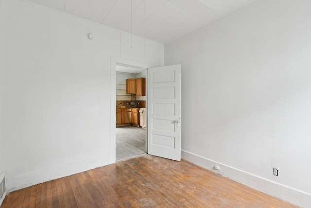 9 Maple St, Jay, ME 04239 - unfurnished room with light wood-style floors and a smoke detector