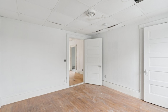 9 Maple St, Jay, ME 04239 - spare room featuring a drop ceiling, hardwood / wood-style floors, and a smoke detector
