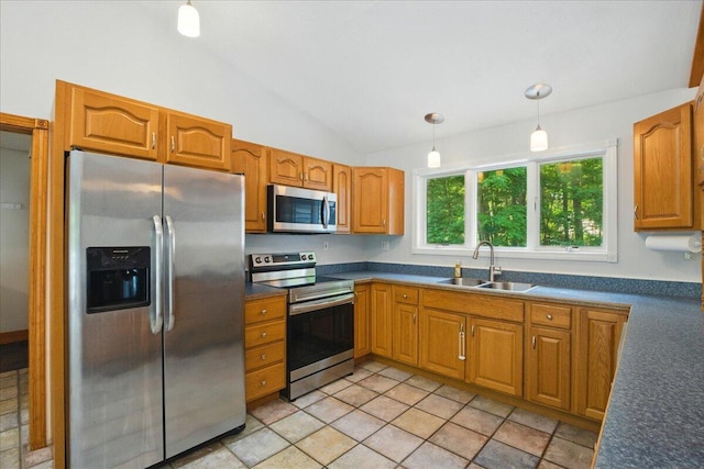 14 Goshen Ln, New Gloucester, ME 04260 - kitchen featuring appliances with stainless steel finishes, a sink, vaulted ceiling, dark countertops, and hanging light fixtures