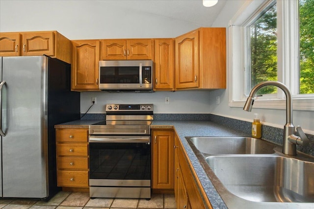 14 Goshen Ln, New Gloucester, ME 04260 - kitchen with appliances with stainless steel finishes, a sink, dark countertops, plenty of natural light, and vaulted ceiling
