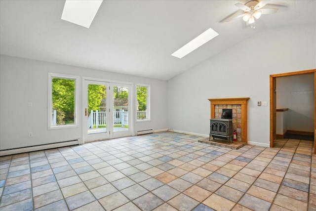 14 Goshen Ln, New Gloucester, ME 04260 - unfurnished living room featuring a skylight, a baseboard heating unit, a wood stove, and high vaulted ceiling