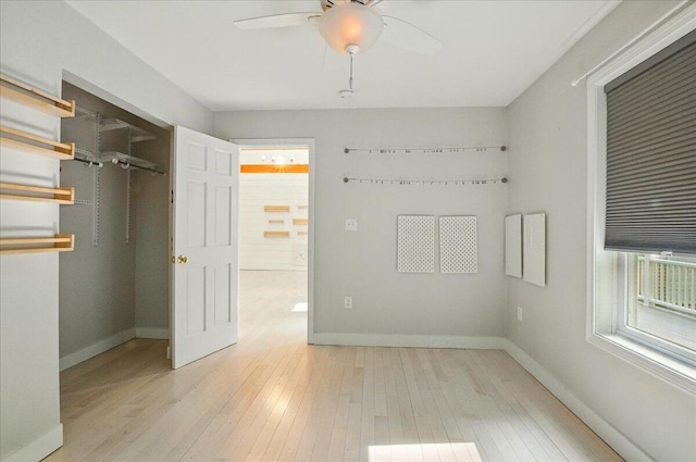 14 Goshen Ln, New Gloucester, ME 04260 - unfurnished bedroom featuring wood-type flooring, baseboards, a closet, and a ceiling fan