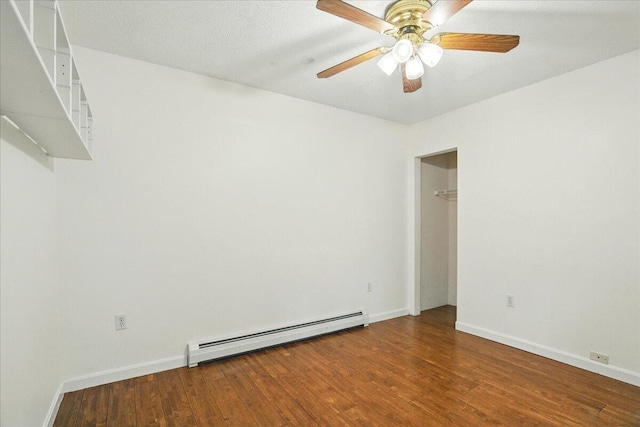 14 Goshen Ln, New Gloucester, ME 04260 - unfurnished room featuring baseboard heating, wood finished floors, a ceiling fan, and baseboards