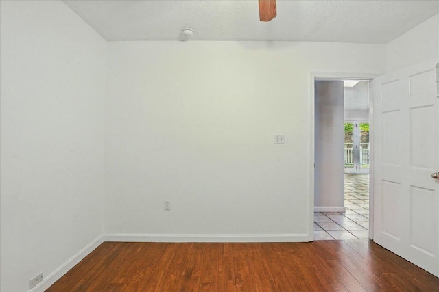 14 Goshen Ln, New Gloucester, ME 04260 - empty room with wood finished floors, baseboards, a ceiling fan, and a smoke detector