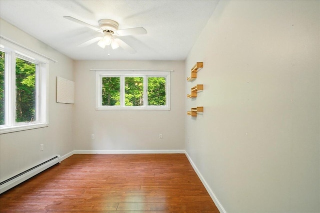 14 Goshen Ln, New Gloucester, ME 04260 - empty room with a baseboard heating unit, plenty of natural light, hardwood / wood-style flooring, and ceiling fan