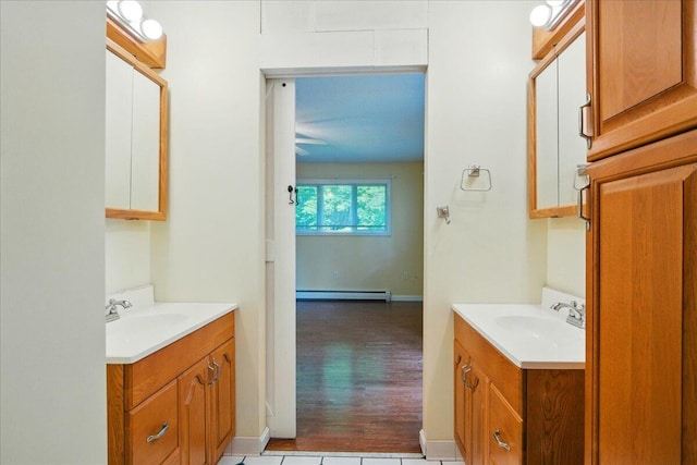 14 Goshen Ln, New Gloucester, ME 04260 - bathroom with vanity, baseboard heating, and baseboards