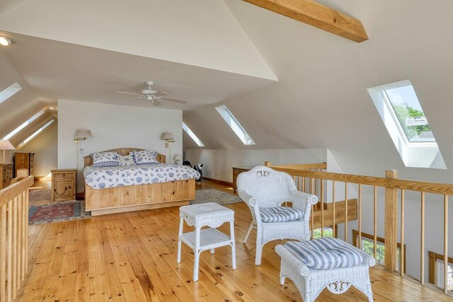 51 Main St Unit 2, Stonington, ME 04681 - bedroom with a skylight, vaulted ceiling, and hardwood / wood-style floors