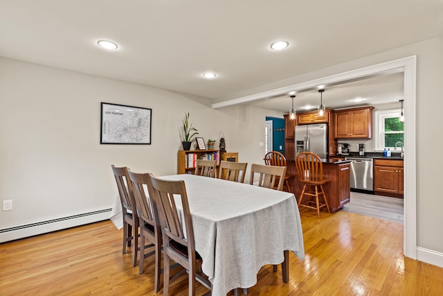 534 Summit St, Portland, ME 04103 - dining room with light wood-type flooring, recessed lighting, and a baseboard heating unit