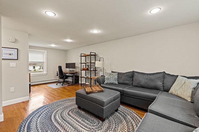534 Summit St, Portland, ME 04103 - living area featuring baseboard heating, light wood-style floors, a desk, and recessed lighting