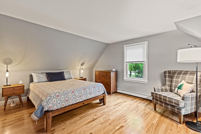534 Summit St, Portland, ME 04103 - bedroom with a baseboard radiator, light wood finished floors, and vaulted ceiling