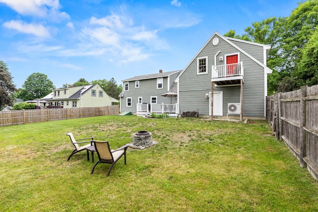 534 Summit St, Portland, ME 04103 - back of property featuring a fenced backyard, a deck, an outdoor fire pit, and a chimney