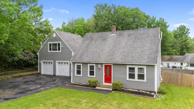 534 Summit St, Portland, ME 04103 - new england style home featuring asphalt driveway, roof with shingles, and a chimney