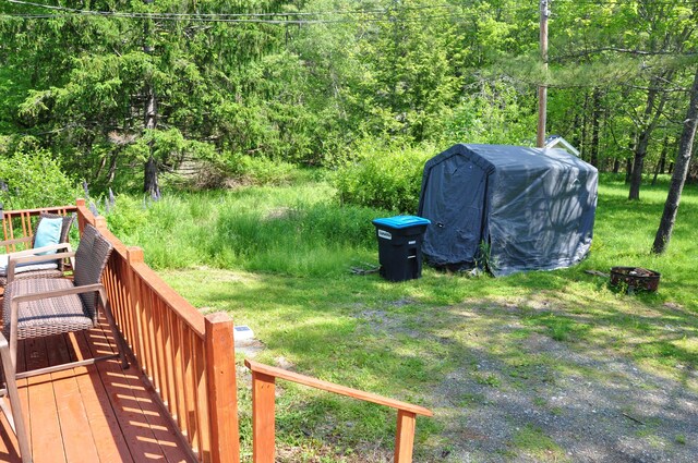 5 Charles St, Orono, ME 04473 - view of yard with a deck and a wooded view