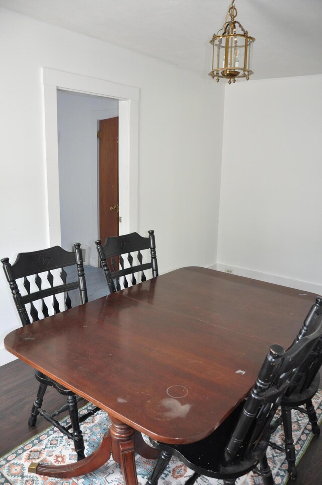 5 Charles St, Orono, ME 04473 - dining space featuring wood finished floors and a chandelier