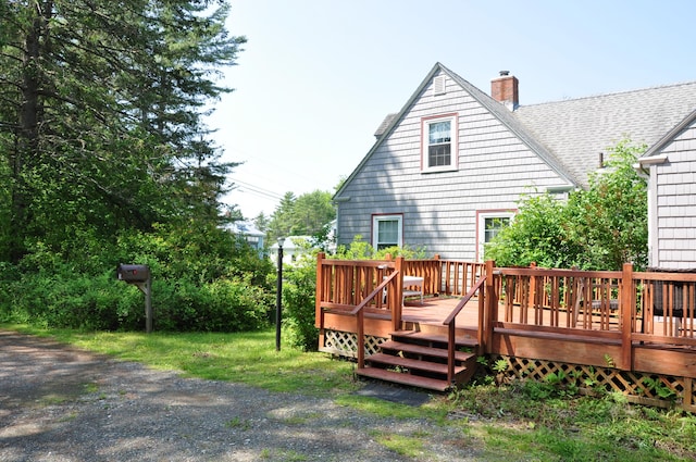 5 Charles St, Orono, ME 04473 - rear view of house with a chimney, a deck, and a shingled roof