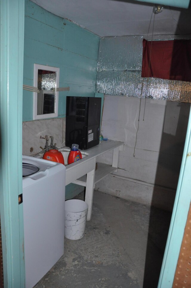 5 Charles St, Orono, ME 04473 - bathroom with washer / dryer and unfinished concrete floors