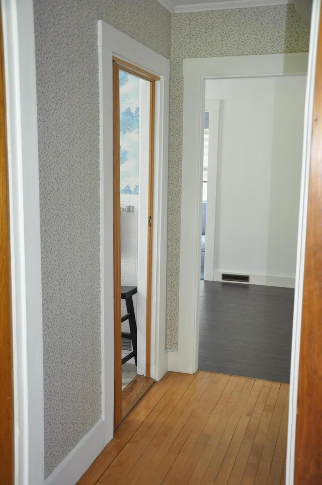 5 Charles St, Orono, ME 04473 - hallway featuring wallpapered walls and wood-type flooring
