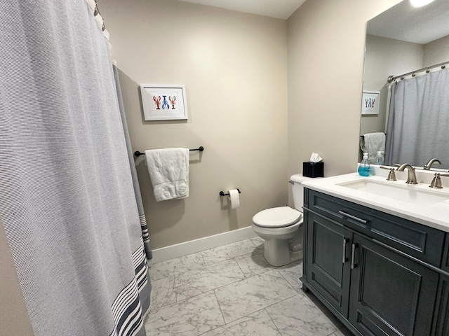 3 Jennifer Ln Unit 1, Wells, ME 04090 - full bath featuring marble finish floors, vanity, toilet, baseboards, and a shower with curtain