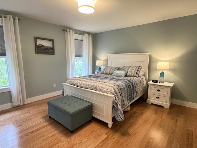 3 Jennifer Ln Unit 1, Wells, ME 04090 - bedroom with multiple windows, baseboards, and light wood-type flooring