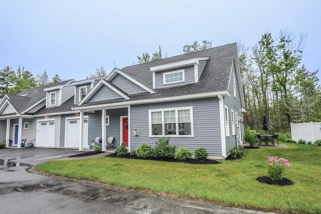 3 Jennifer Ln Unit 1, Wells, ME 04090 - view of front of home featuring a garage, driveway, a front lawn, and roof with shingles