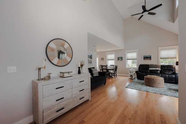 3 Jennifer Ln Unit 1, Wells, ME 04090 - living room with a ceiling fan, high vaulted ceiling, and light wood-style flooring