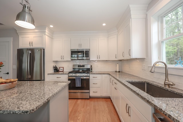 3 Jennifer Ln Unit 1, Wells, ME 04090 - kitchen with stainless steel appliances, white cabinets, backsplash, and recessed lighting