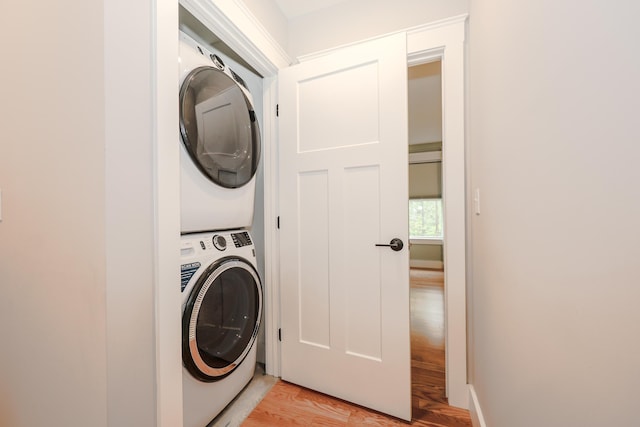 3 Jennifer Ln Unit 1, Wells, ME 04090 - laundry room with estacked washer and dryer and light wood-style flooring