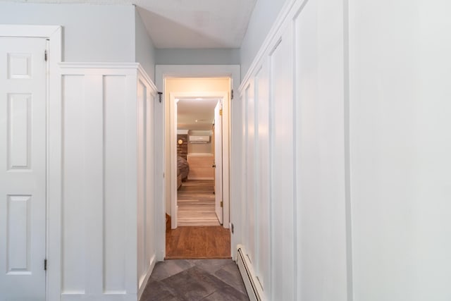 18 Brian Dr, Brewer, ME 04412 - corridor featuring an AC wall unit and a baseboard heating unit