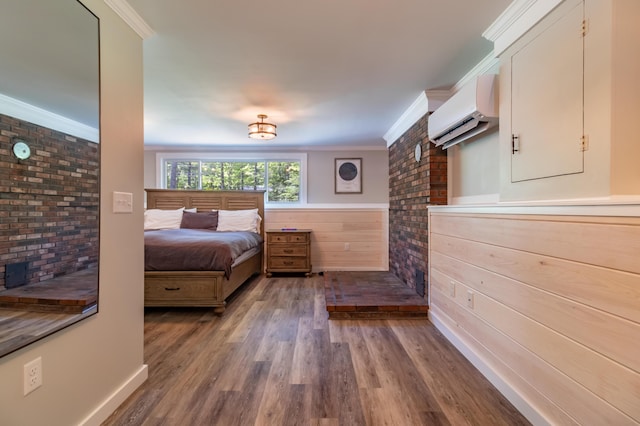 18 Brian Dr, Brewer, ME 04412 - bedroom featuring a wall unit AC, crown molding, wood finished floors, and brick wall