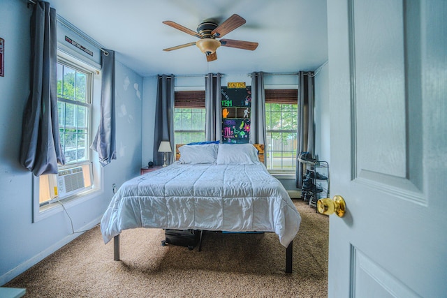10 Empire Way, Portland, ME 04103 - carpeted bedroom featuring multiple windows, ceiling fan, and cooling unit