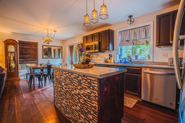 10 Empire Way, Portland, ME 04103 - kitchen with stainless steel appliances, dark wood-style flooring, a center island, decorative light fixtures, and dark brown cabinetry