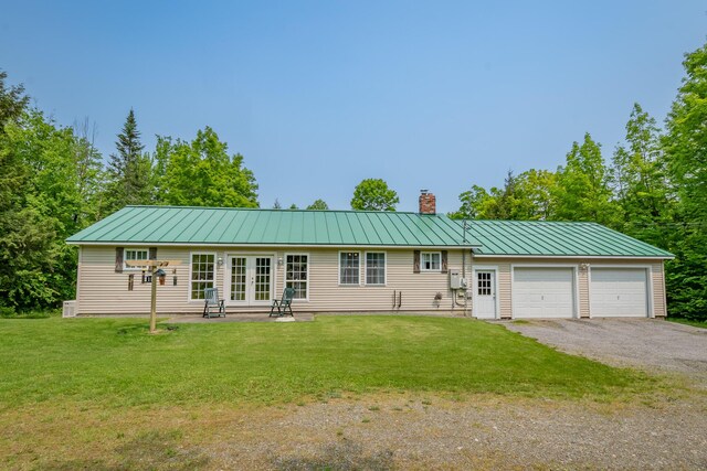 52 Judkins Rd, Harmony, ME 04942 - single story home featuring french doors, a chimney, a front lawn, and a standing seam roof