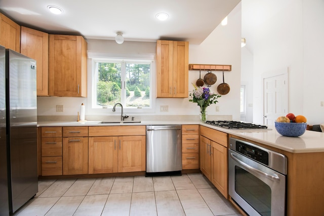 2301 State Route 129, South Bristol, ME 04568 - kitchen featuring stainless steel appliances, a peninsula, light countertops, light tile patterned floors, and recessed lighting
