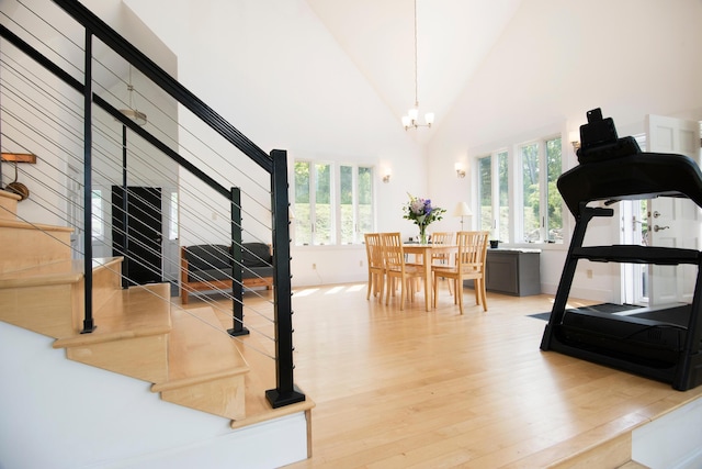 2301 State Route 129, South Bristol, ME 04568 - workout area with light wood-style floors, a chandelier, and high vaulted ceiling