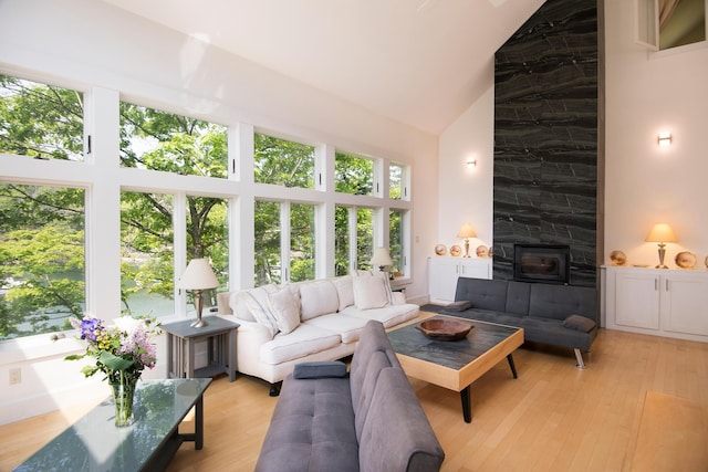2301 State Route 129, South Bristol, ME 04568 - living room featuring high vaulted ceiling and light wood-style flooring