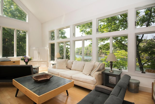 2301 State Route 129, South Bristol, ME 04568 - sunroom / solarium with high vaulted ceiling, a water view, and wood finished floors