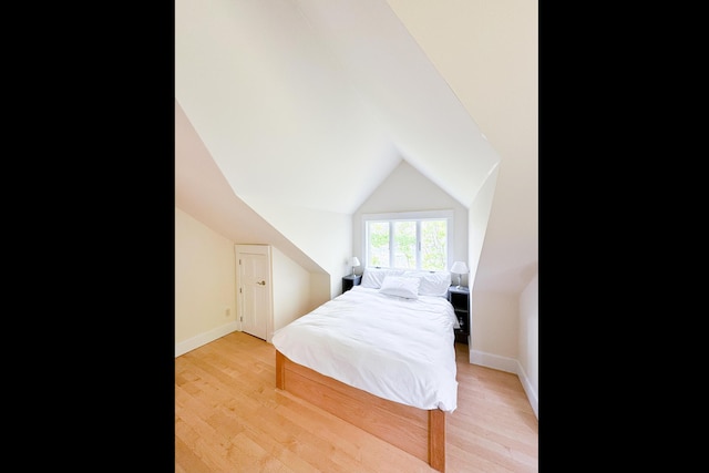 2301 State Route 129, South Bristol, ME 04568 - bedroom featuring light wood finished floors and lofted ceiling