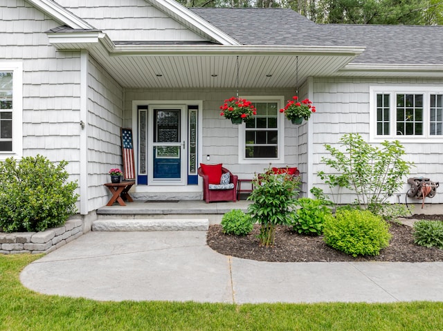2 Neptune Rd, Old Orchard Beach, ME 04064 - property entrance with covered porch and roof with shingles