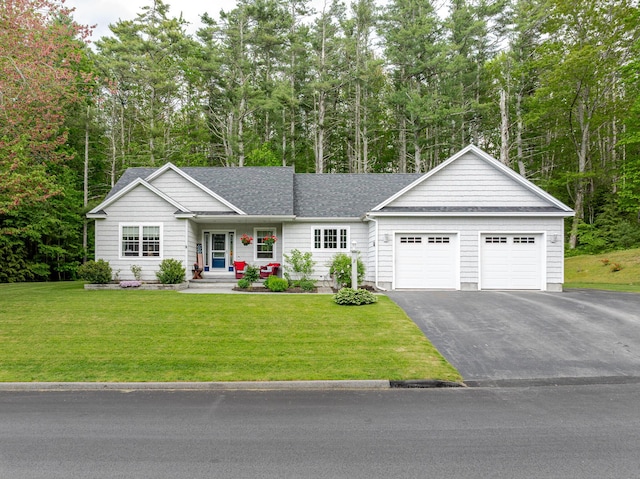 2 Neptune Rd, Old Orchard Beach, ME 04064 - ranch-style home featuring driveway, a garage, a front yard, and a shingled roof