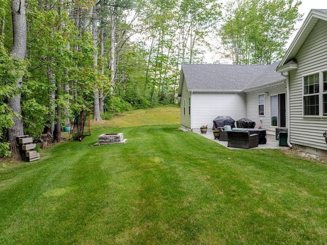 2 Neptune Rd, Old Orchard Beach, ME 04064 - view of grassy yard with an outdoor living space with a fire pit and a patio area