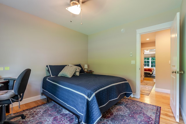 2 Neptune Rd, Old Orchard Beach, ME 04064 - bedroom with light wood-style floors, baseboards, a ceiling fan, and a desk