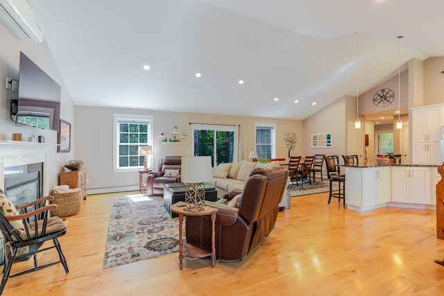 2 Neptune Rd, Old Orchard Beach, ME 04064 - living room featuring an AC wall unit, light wood-style floors, high vaulted ceiling, a baseboard heating unit, and a glass covered fireplace
