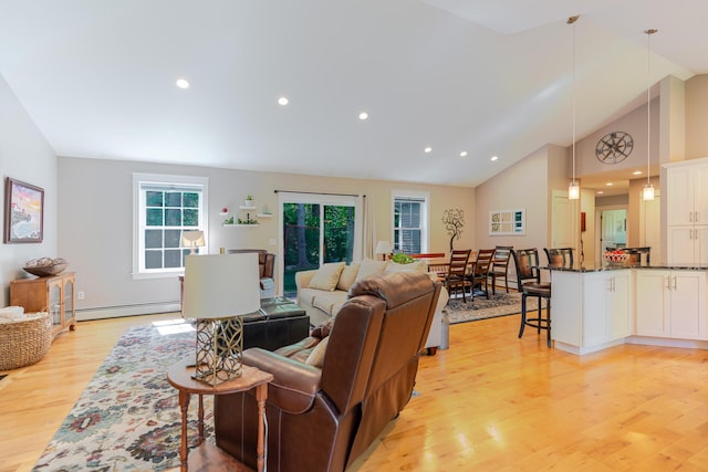 2 Neptune Rd, Old Orchard Beach, ME 04064 - living area with light wood finished floors, baseboard heating, high vaulted ceiling, and recessed lighting