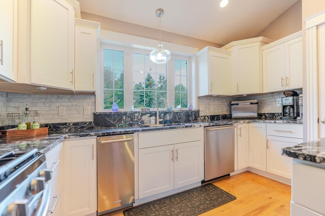 2 Neptune Rd, Old Orchard Beach, ME 04064 - kitchen with stainless steel dishwasher, decorative backsplash, a sink, light wood finished floors, and hanging light fixtures