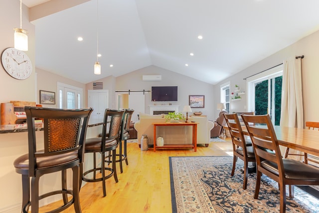 2 Neptune Rd, Old Orchard Beach, ME 04064 - dining area featuring light wood finished floors, lofted ceiling, and recessed lighting