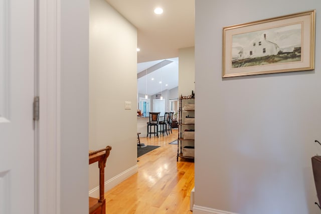 2 Neptune Rd, Old Orchard Beach, ME 04064 - hall featuring light wood finished floors, baseboards, vaulted ceiling, and recessed lighting